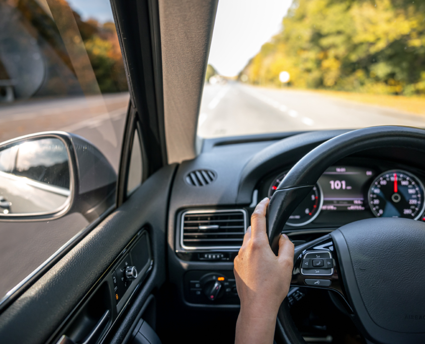 Chauffeur's hands on the steering wheel